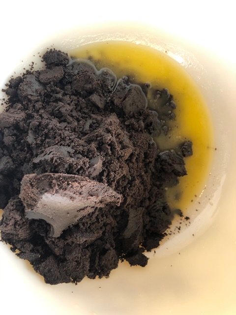 Oreo and butter in mixing bowl